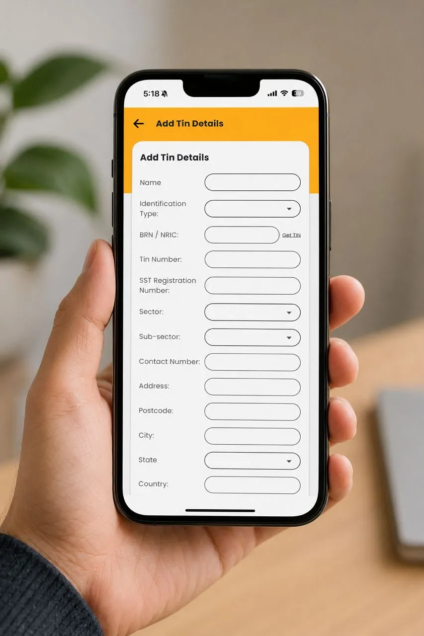 Hand holding a smartphone displaying a digital invoice property billing form on the Gprop Systems mobile app.